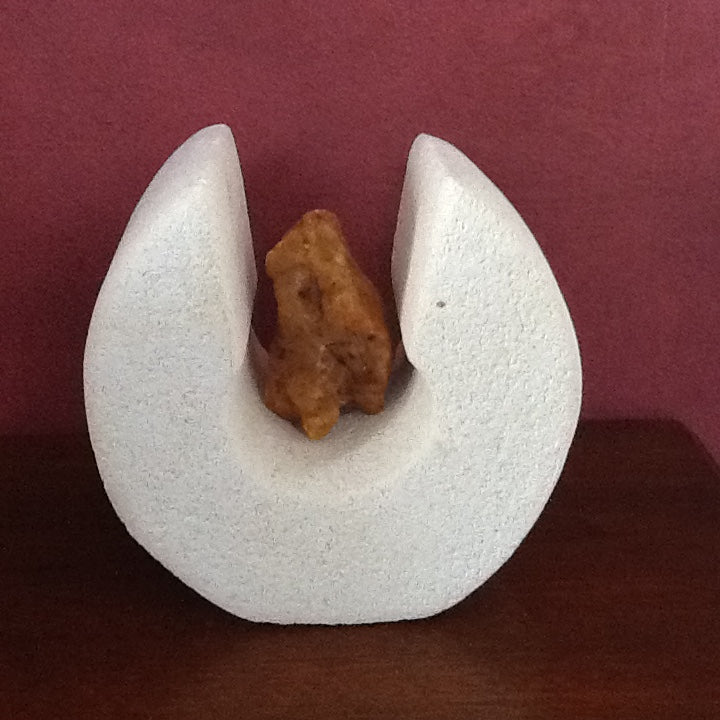 Cradled - Oamaru stone